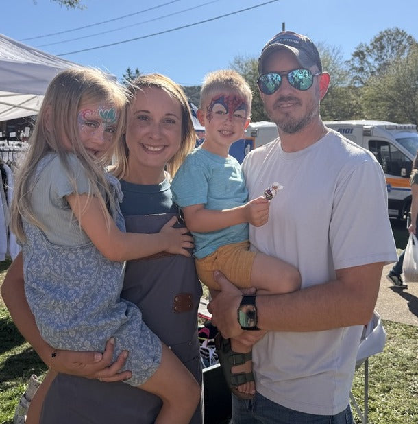Courtney and her family at a fall craft show